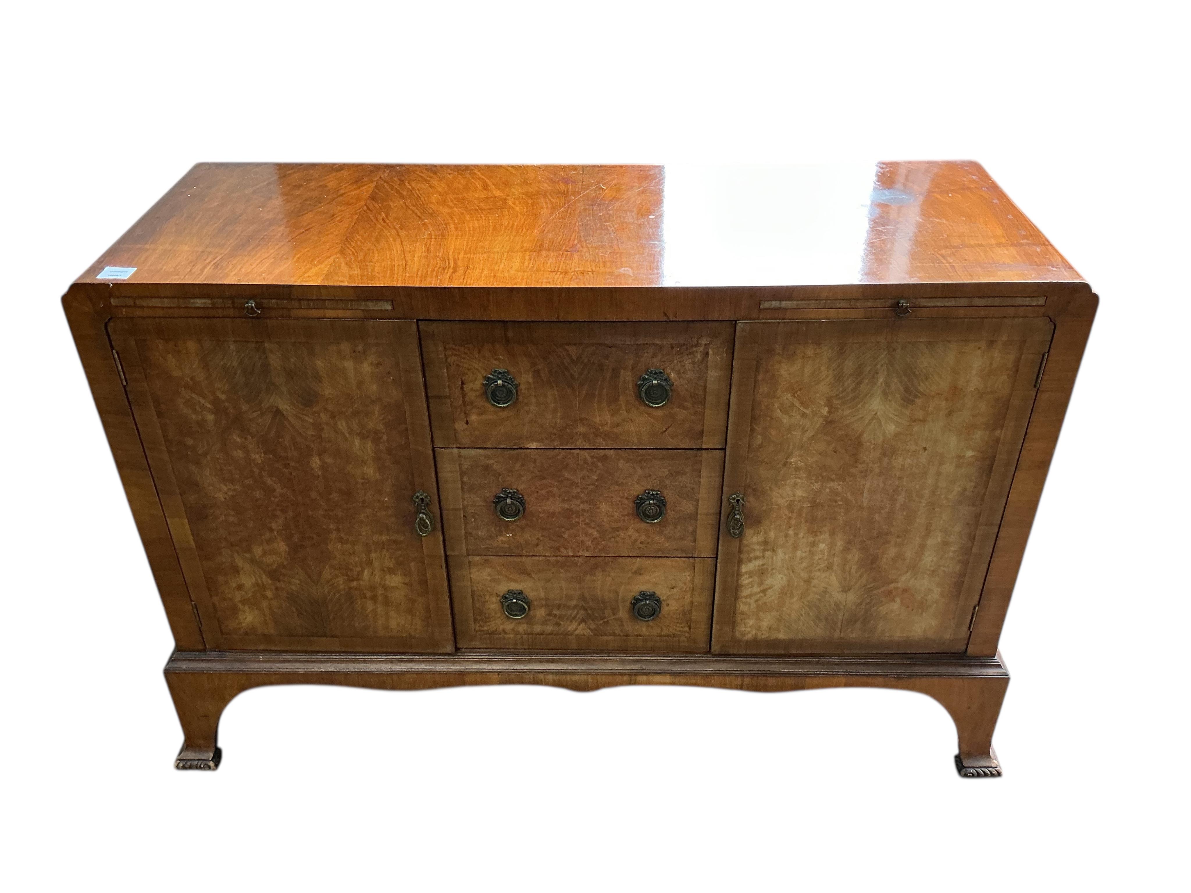 A 1930’s walnut sideboard, width 132cm, depth 46cm, height 90cm
